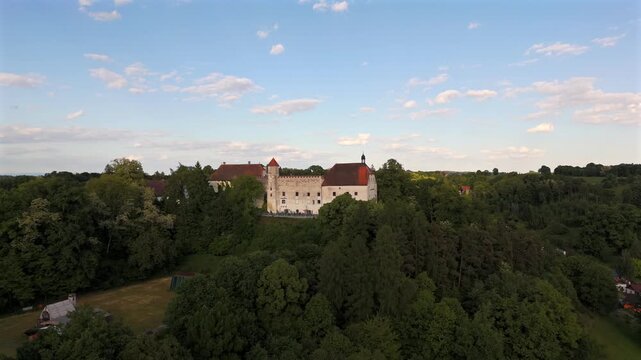 Drone footage Ortenburg Castle in Lower Bavaria, showing Alt-Ortenburg and Vorderschloss. Renaissance architecture, castle garden. Luftaufnahme Schloss Ortenburg, in Marktes Ortenburg, Deutschland. 