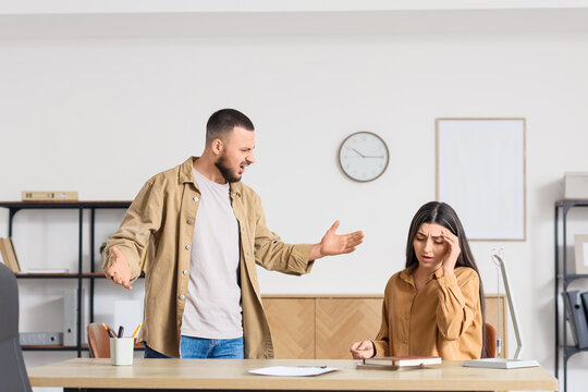 Young man screaming at his wife in psychologist's office