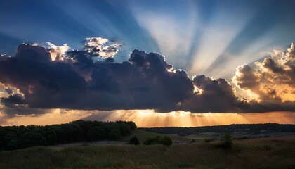 Dark Cumulus Clouds And Sunbeams At Sunset