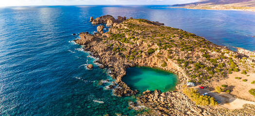 Aerial view of of a small sea crater surrounded by rocks, Voulolimni, Crete