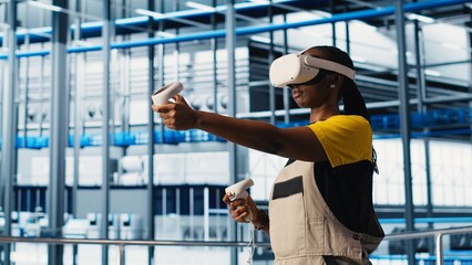 Smart factory engineer implements automated workflows and control systems using virtual reality, computerizing operations. Technician integrates sensors into production using VR headset, camera A
