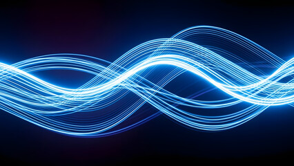 Elegant Waves of Light: A mesmerizing display of flowing, radiant blue light streaks across a dark backdrop, creating an artistic representation of energy, connectivity and digital movement.