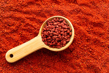Bixa Orellana - Crushed annatto seeds in the measuring spoon