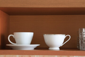 Close-Up of Glasses on Kitchen Shelves