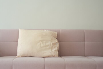 Mid Shot of a Pillow on a Pink Sofa
