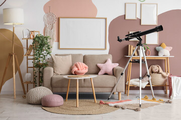 Interior of stylish children's room with sofa, toys and modern telescope