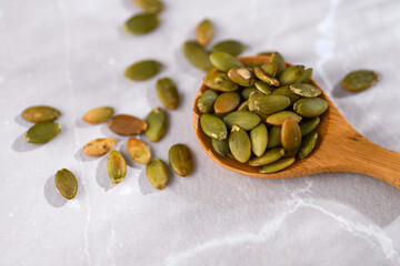 Close up of Roasted Pumpkin Seeds on Bamboo Spoon