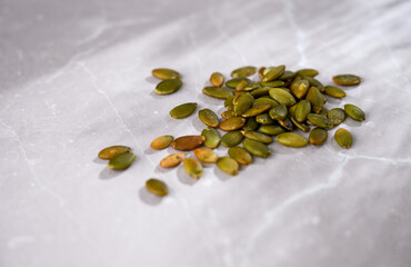 Close up of Roasted Pumpkin Seeds on Bamboo Spoon