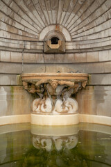 Detailed Bas-relief Sculpture and Basin of a Historic Fountain near Sacr&eacute;-C&oelig;ur Basilica