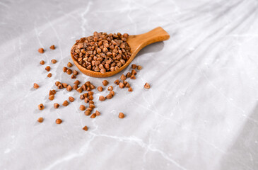 Close up of Buckwheat Grains in Bamboo Spoon