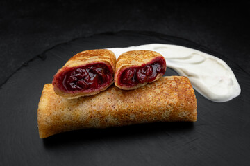 Sweet cherry stuffed fried blini