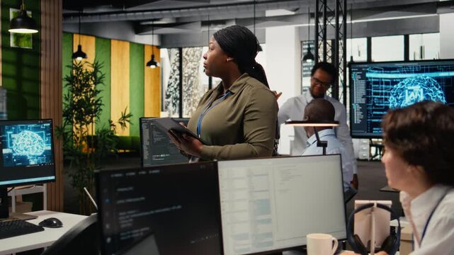 Portrait of smiling engineer working in office, using specialized hardware to accelerate complex AI calculations. Happy woman managing systems for machine learning training datasets, camera A