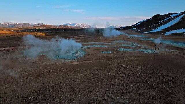Drone footage of Hverir geothermal area in North Iceland. Steam rises from boiling mud pools and sulfur vents across the volcanic terrain..