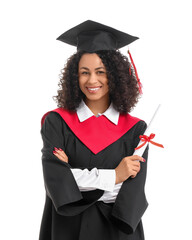 Pretty African-American female graduate with diploma on white background