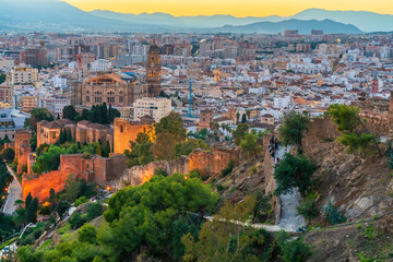 Rooftop view of Malaga old town and Alcazaba at sunrise. Spain