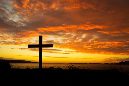 Christian Cross River Mouth Sunset Silhouette