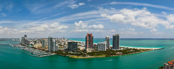Panorama of Miami Beach with turquoise waters. Drone shot of Miami skyline. Top view of South Beach. Miami cityscape with luxury skyscrapers and ocean. View of Miami famous coastline.