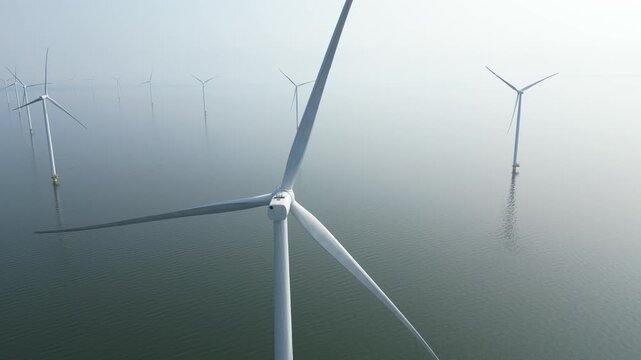 4K aerial view of an offshore windpark during calm weather, Breezanddijk, The Netherlands