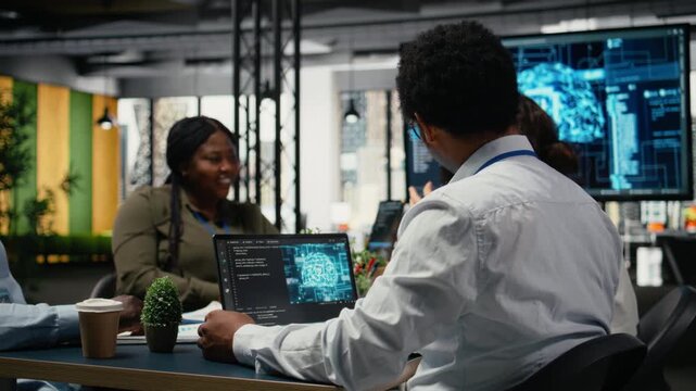 Data scientists in startup office brainstorming leveraging AI tech to gain competitive edge. Coworkers doing meeting to discuss training deep learning predictive models, camera A