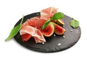 Board with slices of tasty prosciutto, basil and figs on white background