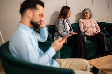 People waiting in a modern waiting room