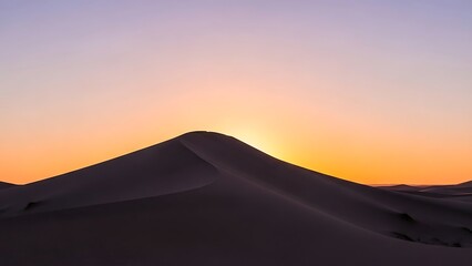 Serene Desert Dune Landscape Under a Warm Sunset Glow, Creating a Tranquil and Inviting Atmosphere