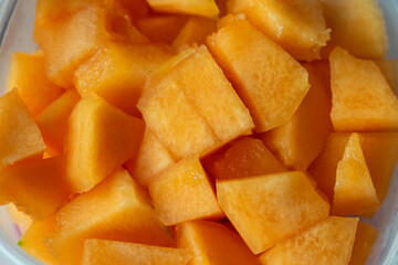 Close-up photograph of melons cut into cubes