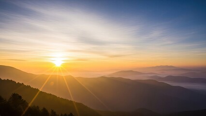Sunrise over mountain range with golden light and vibrant sky