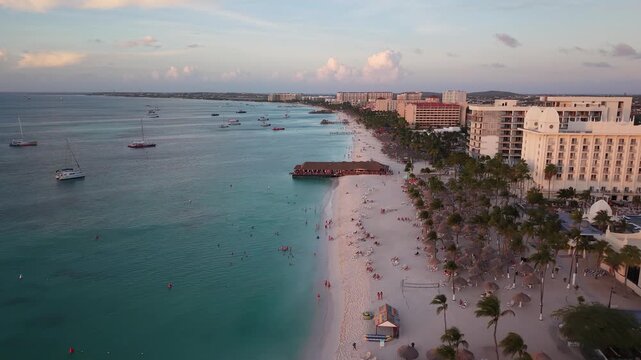 4K 60FPS Cinematic: Palm Beach Sunset Side Flyover, Aruba Pier and Resorts.