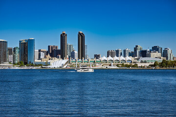 2025-11-28 DOWNTOWN SAN DIEGO SKYLINE WITH THE CONVENTION CENTER AND THE RANY SHELL FROM CORANADO ISLAND WITH A NICE BLUE SKY