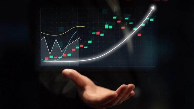 A hand extends towards a digital screen displaying a stock market graph, featuring colorful candlesticks and curves that indicate growth and financial trends. Copula - Powered by Adobe