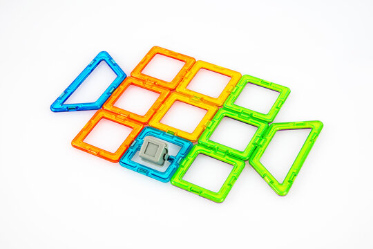 Child Finishing Colorful Treasure Chest with Interlocking Bricks