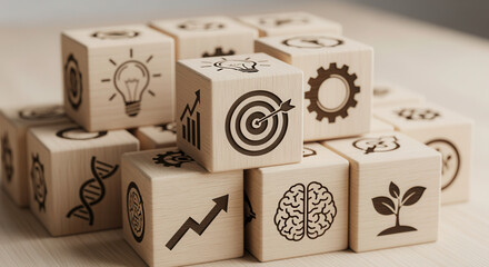 Wooden cubes featuring innovation development symbols arranged using controlled depth and minimal gently blurred backdrop