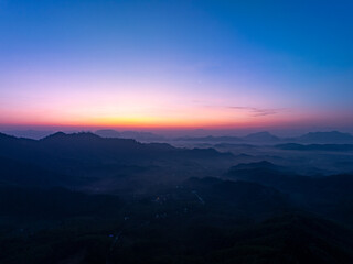 Aerial view sunset or sunrise over mountains nature background