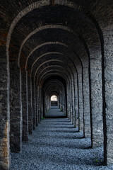Fototapeta premium The profound beauty of the ancient arched corridor
