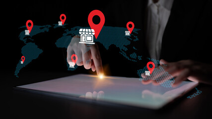 A person using a digital tablet interacts with a dynamic map displaying location markers, highlighting the intersection of technology and global business potential. Gantry