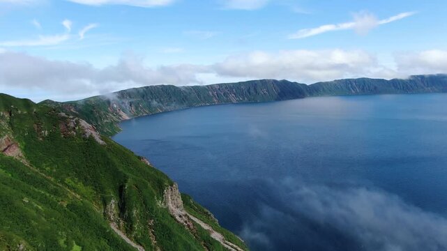 Flight over the caldera of the extinct volcano Lion's Mouth, Iturup Island, Kuril Islands