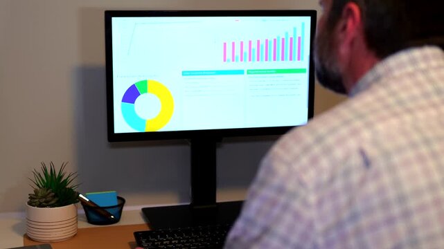 Middle Aged Business Analyst Reviews Clean Energy Conversion Executive Report from Home Office - Green Power Long Term Savings Concept