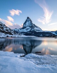 Snowy mountain reflects in clear lake