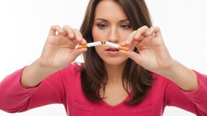Woman breaking cigarette showing commitment to quit smoking for better health
