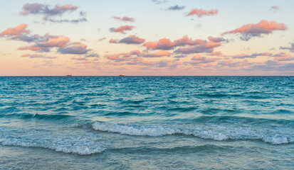 Romantic summer vacation on sunset seascape. Sea sunset on ocean. Sunset seascape at summer vacation. Sunrise with sea beach. Dramatic sunrise horizon at sea. Sea waves