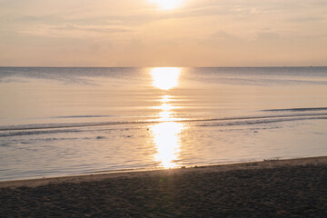 Tropical Beach Sunset Horizon with Golden Sky and Warm Light, Romantic Ocean View Background