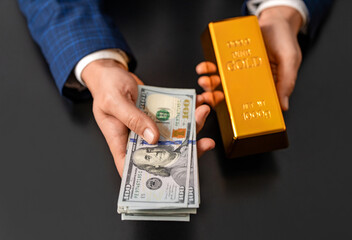 Rich businessman saving gold and cash money. Financial saving success. Successful rich man with gold and money. Business success man with gold bar. Golden bar. Golden bar vs dollar money