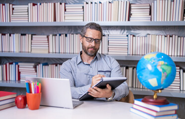 teacher at bookstore. school education. Teacher in school classroom noting. education with hispanic teacher. millenial teacher educate. Man teaching lesson in class. teachers day. back to school