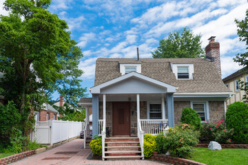 Suburban neighborhood. Suburban house architecture. Private house. Neighborhood architecture. Property in neighborhood. Residential property house. Residence architecture. House exterior