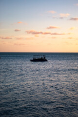 Portrait of a boat in the middle of the sea.