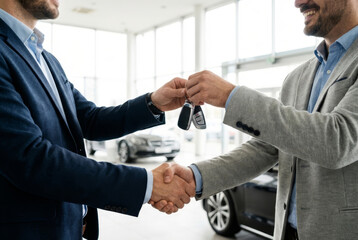 Car Dealership Handshake and Key Handover