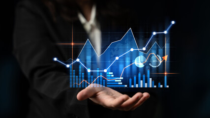 Professional displaying advanced data graphics in hand, showcasing business trends, analysis, and key performance indicators for insightful decision-making. Scalp