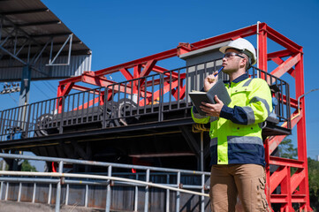 A specialist treatment engineer is planning to expand the treatment pond so that it can treat enough water for community use.