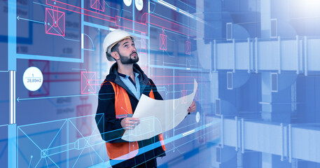 Ventilation engineering specialist reviews duct blueprints, assessing airflow routes and equipment placement for HVAC system planning and building ventilation design.